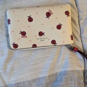 White Coach wristlet with ladybugs